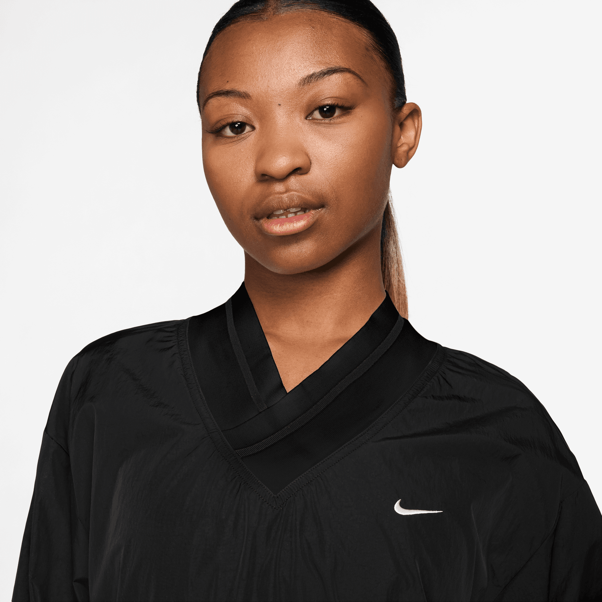 NIKE SPORTSWEAR ESSENTIAL WOMEN S LOOSE UV WOVEN LONG SLEEVE V NECK TOP