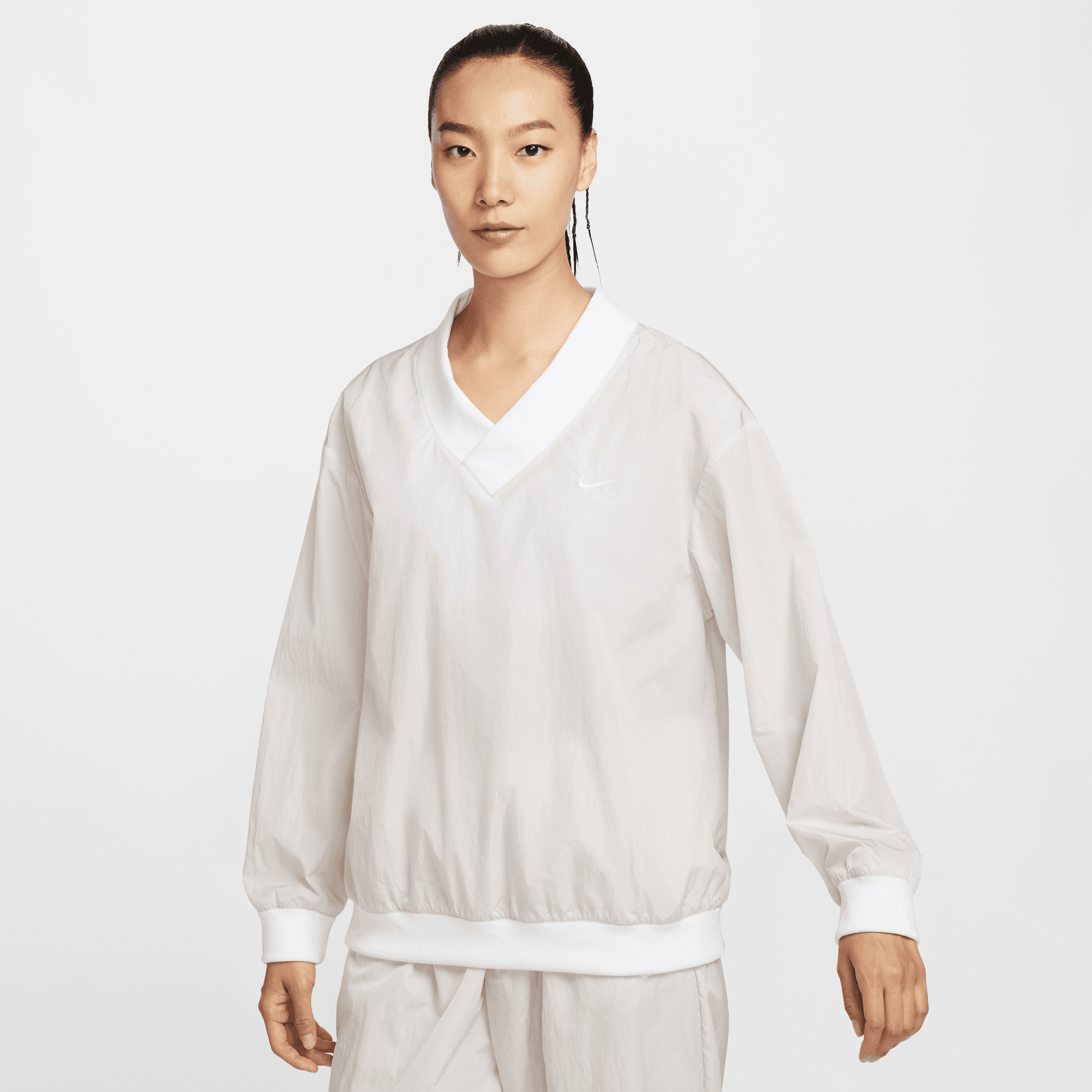 NIKE SPORTSWEAR ESSENTIAL WOMEN'S LOOSE UV WOVEN LONG-SLEEVE V-NECK TOP