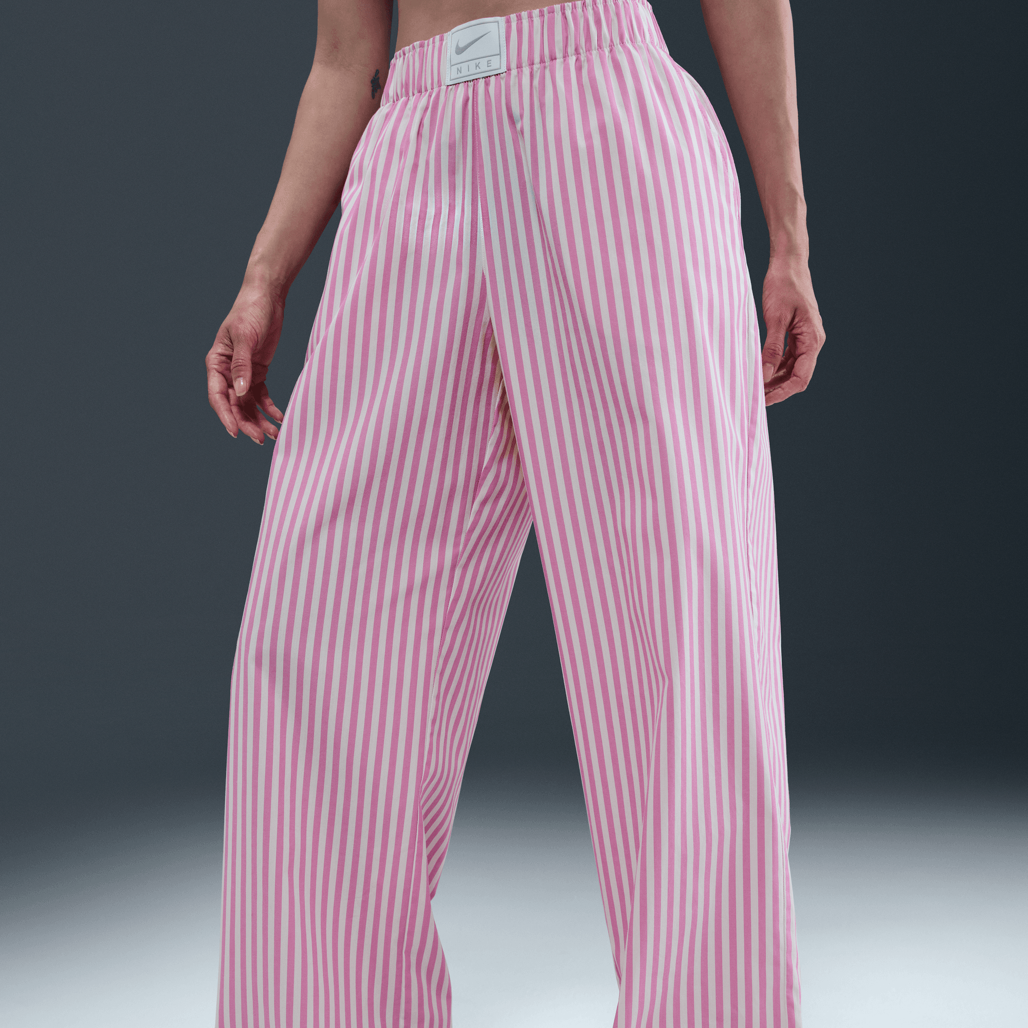 NIKE SPORTSWEAR CHILL POPLIN WOMEN'S MID-RISE LOOSE STRIPED PANTS