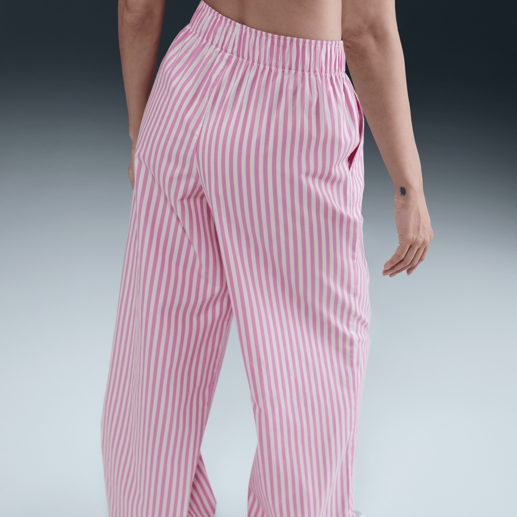 NIKE SPORTSWEAR CHILL POPLIN WOMEN'S MID-RISE LOOSE STRIPED PANTS